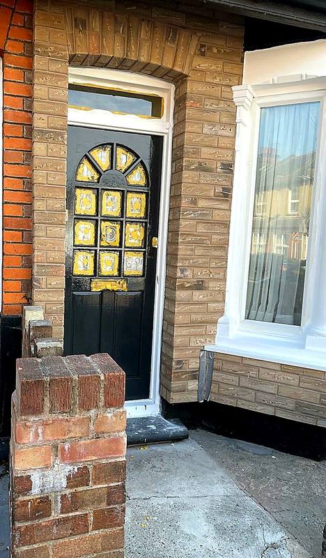 Terraced house frontage finished in brick-effect render in the West Midlands