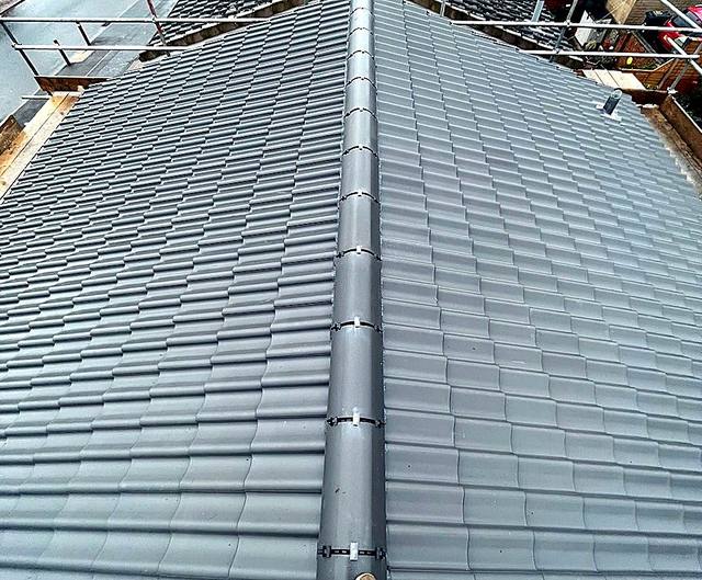 Mechanically fixed dry ridge running the length of a new roof in Halesowen