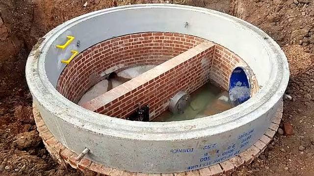 Brick drainage chamber built inside precast concrete rings in the Wolverhampton area