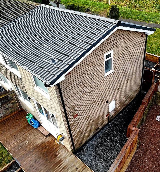 Aerial view of a semi-detached house with a newly tiled roof in Halesowen