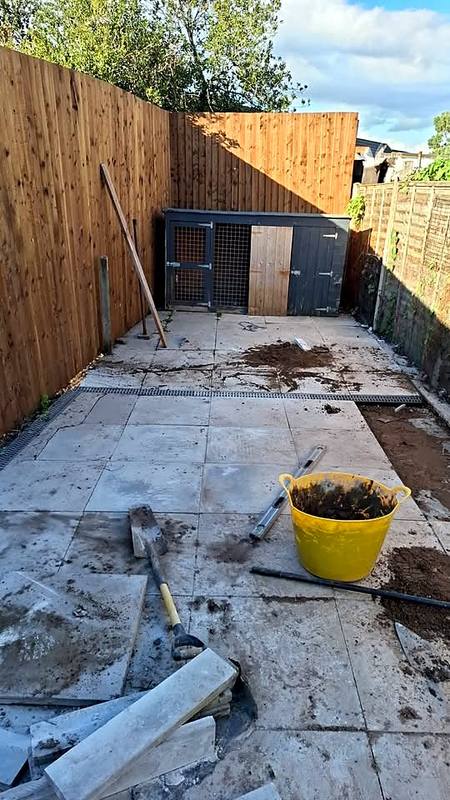 Relaid patio with a new channel drain across it in Northfield