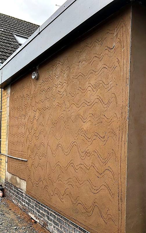 Scratch coat render applied to an extension wall in the West Midlands