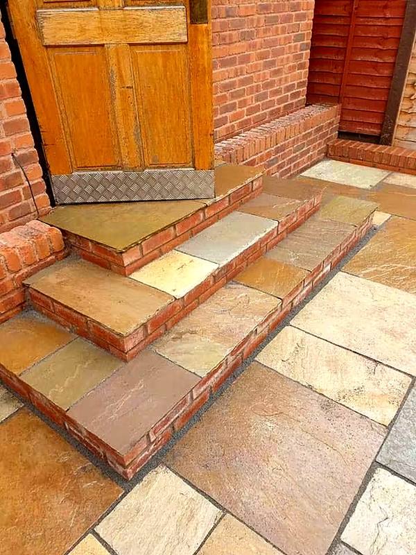 Sandstone steps with brick risers leading to a back door in the Wolverhampton area