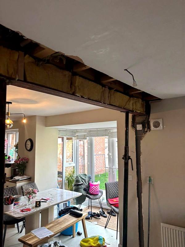 Kitchen wall opened up into the dining room with props in place in Stafford