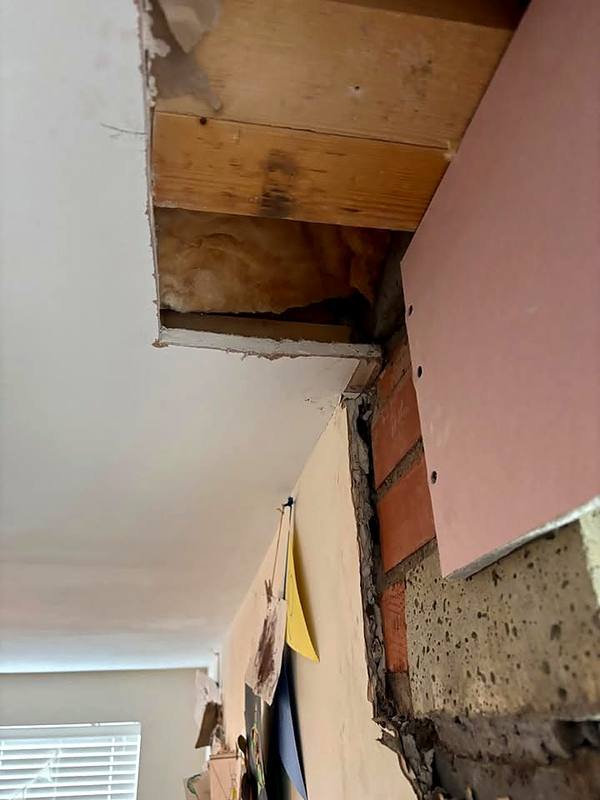 Ceiling patch reboarded beside the new steel in Stafford