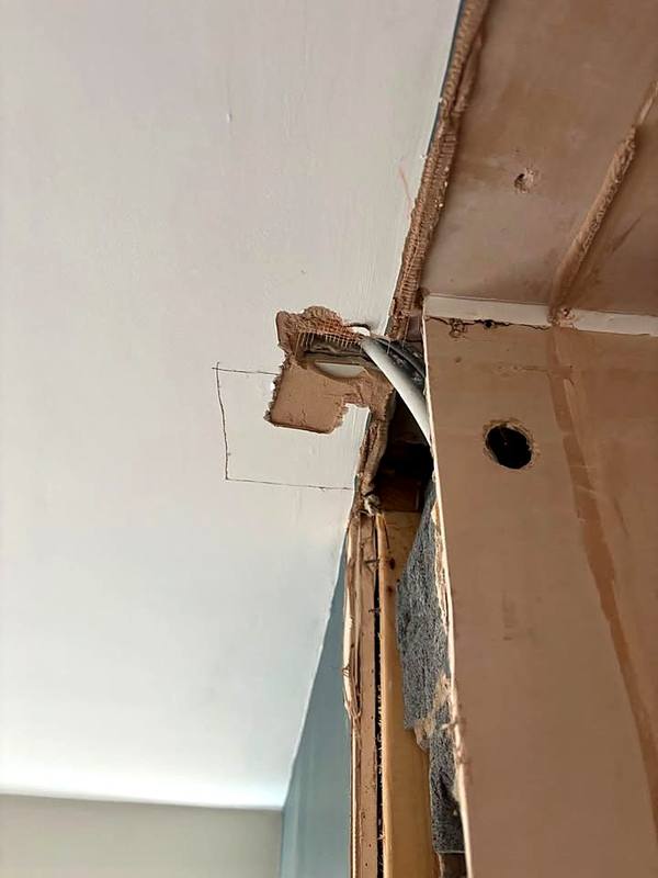 Ceiling opened up to reroute cables before plastering in Stafford