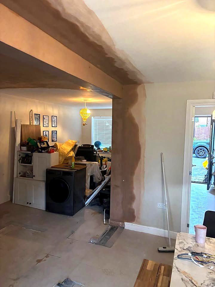 New return corner and beam plastered between the kitchen and dining room in Stafford