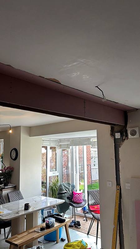 New steel beam in place over a widened kitchen opening in Stafford